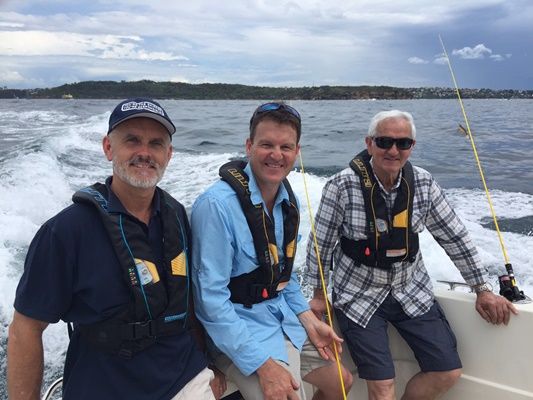 Neil Patchett left educates Rob's dad on the importance of wearing life jackets