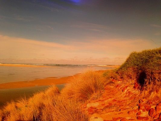 The entrance to Mallacoota Lake at dusk is picturesque and inviting