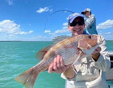 One on board and another on the line – hot fishing in the NT abounds!