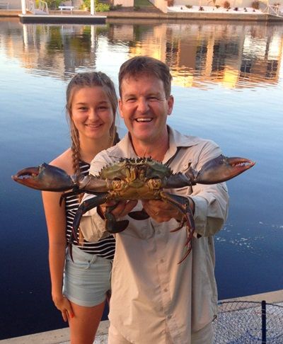Rob and Daughter Caitlin with one of the Huge Mud Crabs that Pelican Waters residents catch at their back door