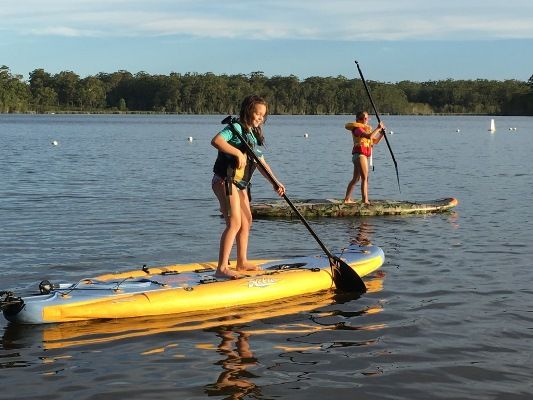 The Hobie i11s (foreground) doubles up as an SUP. It has almost the same hull as the Hobie Sportsman SUP (background)