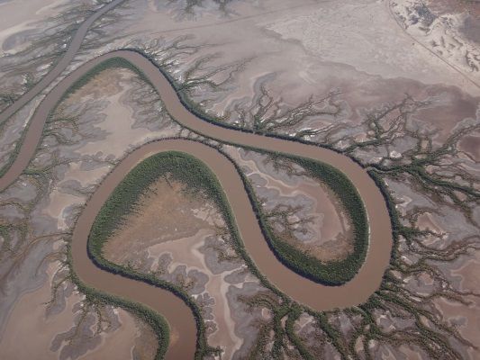 The scenery constantly changes from rivers painting a a path through a desolate landscape